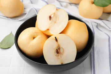 Delicious apple pears on white tiled table