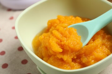 Baby food. Tasty pumpkin puree on table, closeup
