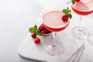 Raspberry martini cocktail with vodka, juice and raspberry liqueur