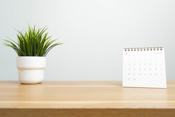 February 2023 calendar page on wood background. Calendar background for reminder, business...