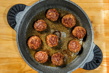 Fryed meatballs on black background, top view, copy space. Beef roasted meatballs ready for eat.