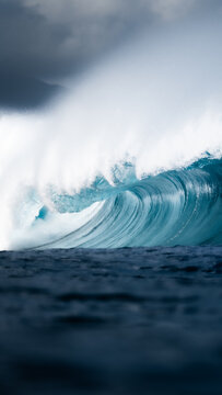 Beautiful deep blue tube ocean wave barrel 