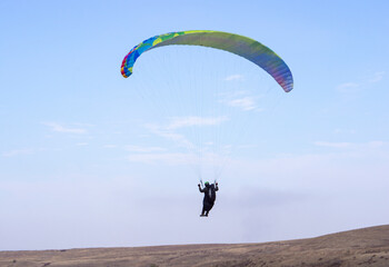 Active sport, paraglider and people in the sky. Instructor and passenger on a paraglider.
