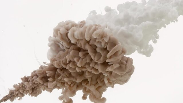 Background shot for BB cream commercial | Macro shot of brown and white inks are being injected in water from two different corners mixing into beige one on white background