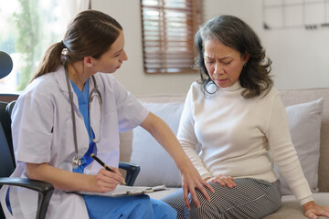 Female nurses give advice to patients with osteoarthritis and knee pain and educate them on health...