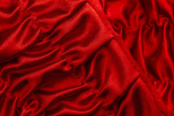 Obraz premium fabric in red shiny waves as a detail as a graphic element for the background
