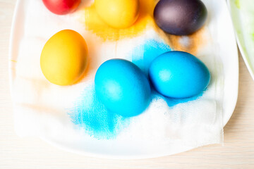 Painted eggs on the table after painting, a symbol of Easter, eggs 