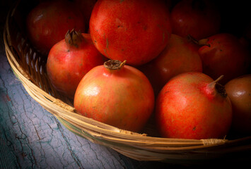 Freshly picked pomegranate fruits in a bowl which is rich in antioxidants