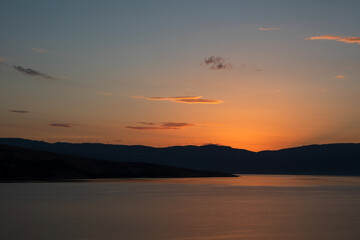 Fototapeta na wymiar sunset over the sea sunset over the lake sunset over the river Croatia Baška sunset on the coast lake and mountains Croatia Baška mountain Croatia Baška sea Croatia Baška