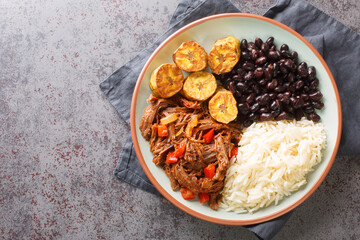 Pabellon Criollo Venezuela's national dish with shredded beef, rice, black beans and fried...