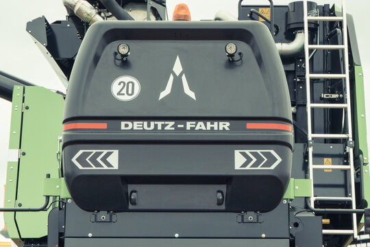 Bednary, Poland - September 25, 2021: Agroshow. Deutz-Fahr brand combine harvester machine. Manufacturer agricultural equipment. Detail and part of vehicle