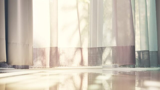 B roll - Transparent curtain moved by the wind on the door with sunlight.