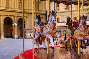 Antique carousel with wooden horses on Piazza della Republica Florence, Italy © SvetlanaSF