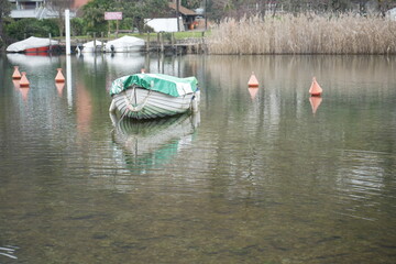 Obraz premium Boat on the lake in Lavena Ponte Tresa, Province of Varese, Italy