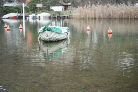 Boat on the lake in Lavena Ponte Tresa, Province of Varese, Italy © Gio