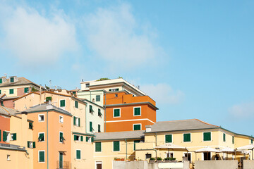 Obraz premium Traditional European architecture in old mariners' village Boccadasse, Italy. Colorful old buildings on a blue sky background