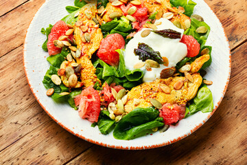Fresh salad with chicken breast, herbs and pomelo