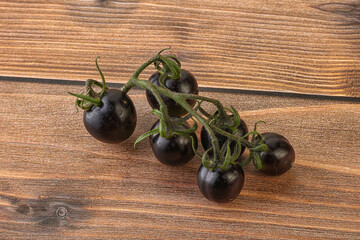 Ripe tasty black cherry tomato