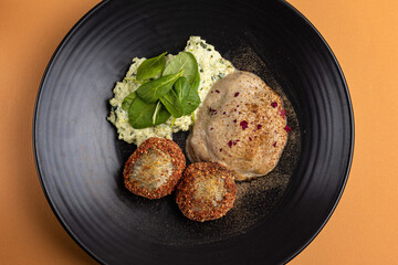 a delicious fish dish on a plate prepared in a restaurant.

