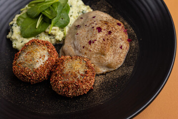a delicious fish dish on a plate prepared in a restaurant.
