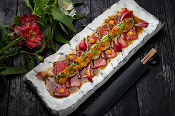 delicious tuna dish on a plate prepared in a restaurant.
