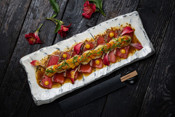 delicious tuna dish on a plate prepared in a restaurant.
