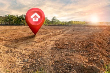 Foto op Canvas House symbol with location pin and Empty dry cracked swamp reclamation soil, land plot for housing construction project with and beautiful sunset sky with fresh air Land for sales landscape concept © Gan