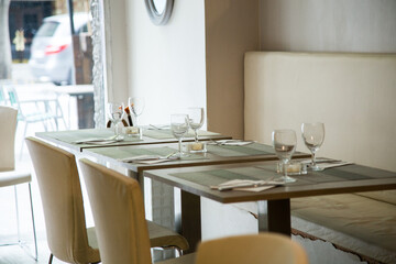 Elegant restaurant table with cutlery, crockery and glasses.