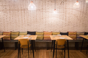 Elegant restaurant table with cutlery, crockery and glasses.