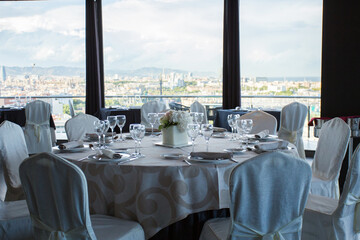 Elegant restaurant table with cutlery, crockery and glasses.
