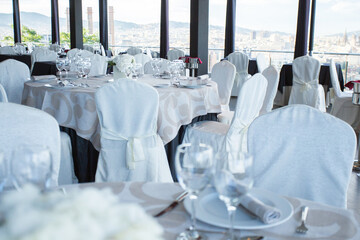 Elegant restaurant table with cutlery, crockery and glasses.