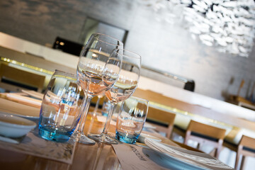 Elegant restaurant table with cutlery, crockery and glasses.