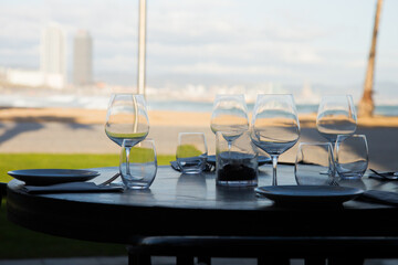 Elegant restaurant table with cutlery, crockery and glasses.