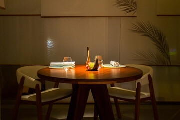 Elegant restaurant table with cutlery, crockery and glasses.