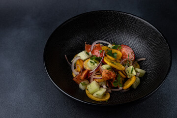 a delicious salad on a plate prepared in a restaurant.
