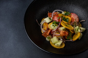 a delicious salad on a plate prepared in a restaurant.

