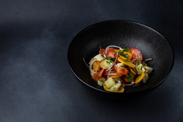 a delicious salad on a plate prepared in a restaurant.
