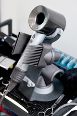 Naklejka premium hair dryer and beauty tool in barbershop