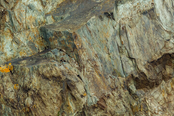 Rough stone background. Rocky wall, abstract natural pattern.
