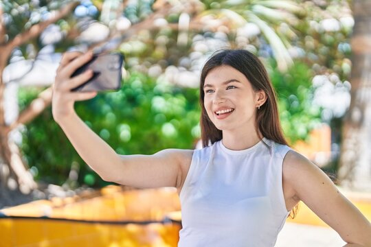 Young caucasian woman smiling confident making selfie by the smartphone at park