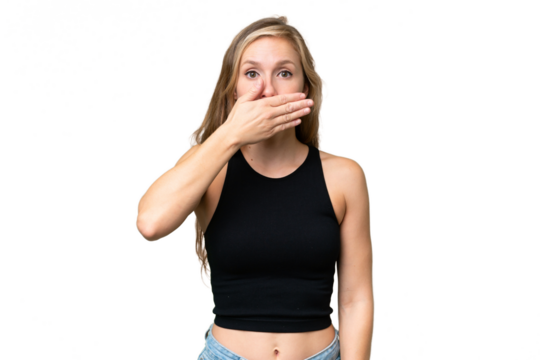 Young blonde woman over isolated background covering mouth with hand