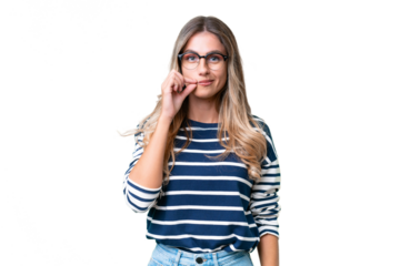 Young Uruguayan woman over isolated background showing a sign of silence gesture