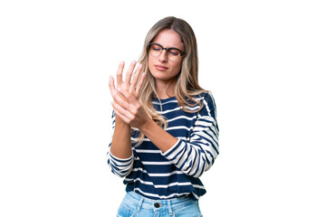 Young Uruguayan woman over isolated background suffering from pain in hands