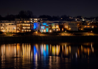 Fototapeta na wymiar Night landscape and light of houses on Phoenix lake in Dortmund Germany