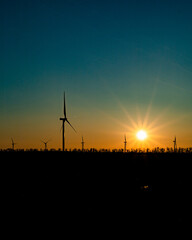 wind turbines at sunset