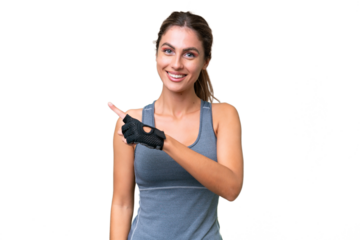 pretty Sport Uruguayan woman over isolated background pointing to the side to present a product