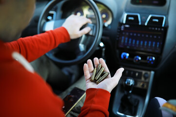 dollars with a car key lie in inside cars. financial concept