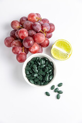 Spirulina is a useful supplement. on a white background
