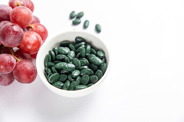 Spirulina is a useful supplement. on a white background
