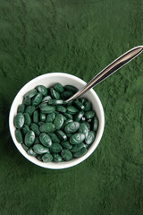 Spirulina is a useful supplement. on a white background
